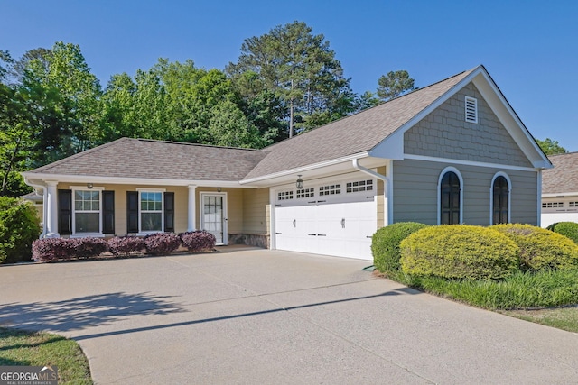 308 Jessica Way, Canton, GA 30114 - view of front facade with an attached garage, driveway, and a shingled roof