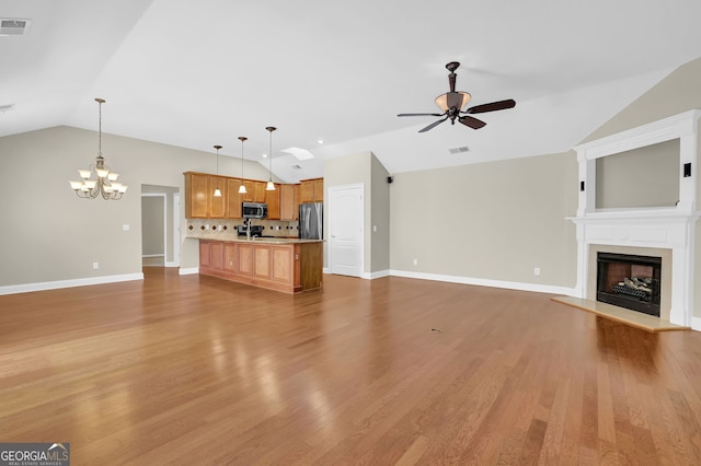 308 Jessica Way, Canton, GA 30114 - unfurnished living room with lofted ceiling, ceiling fan, a chandelier, a fireplace with raised hearth, and baseboards