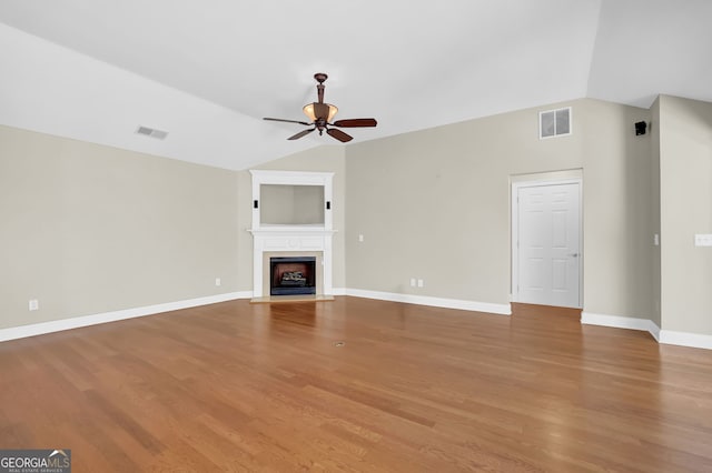 308 Jessica Way, Canton, GA 30114 - unfurnished living room featuring a ceiling fan, wood finished floors, a fireplace with flush hearth, baseboards, and lofted ceiling