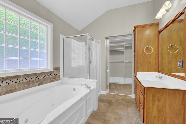 308 Jessica Way, Canton, GA 30114 - full bath with a stall shower, a whirlpool tub, vanity, lofted ceiling, and baseboards
