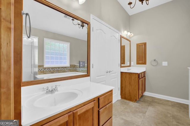 308 Jessica Way, Canton, GA 30114 - bathroom featuring vanity, a garden tub, and baseboards