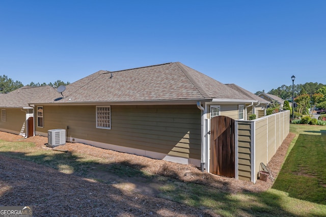 308 Jessica Way, Canton, GA 30114 - rear view of house featuring central AC unit and a shingled roof