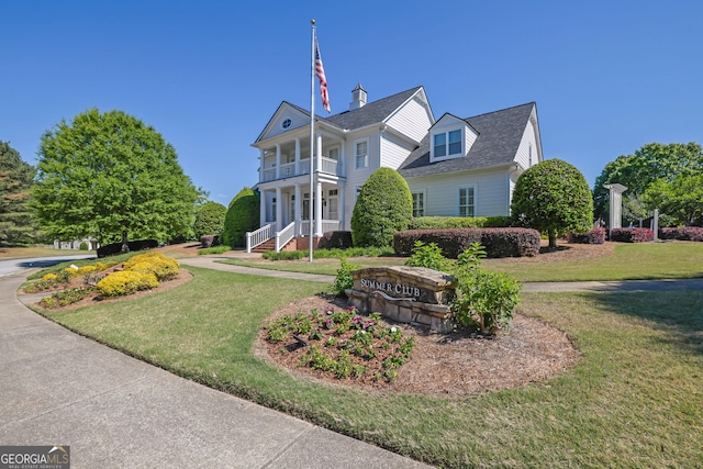 308 Jessica Way, Canton, GA 30114 - view of front of house with a front yard, a balcony, and a shingled roof