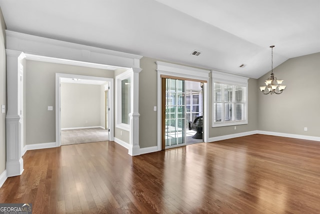 308 Jessica Way, Canton, GA 30114 - unfurnished room with wood-type flooring, a chandelier, lofted ceiling, and baseboards