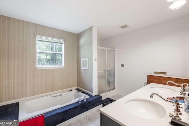 40 Carole Dr, Carrollton, GA 30117 - full bathroom with a shower stall, a bath, double vanity, and a sink