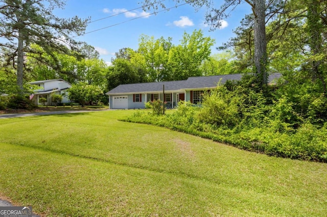 40 Carole Dr, Carrollton, GA 30117 - view of yard with aphalt driveway and an attached garage