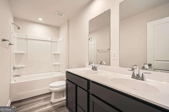 8491 Limerick Ln, Winston, GA 30187 - full bath featuring toilet, visible vents, wood finished floors, and a sink