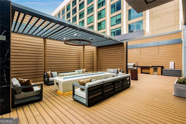 40 12th St NE Unit 803, Atlanta, GA 30309 - wooden deck featuring an outdoor living space with a fire pit