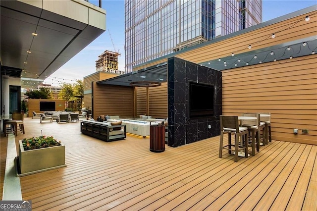 40 12th St NE Unit 803, Atlanta, GA 30309 - wooden terrace featuring an outdoor bar and outdoor lounge area