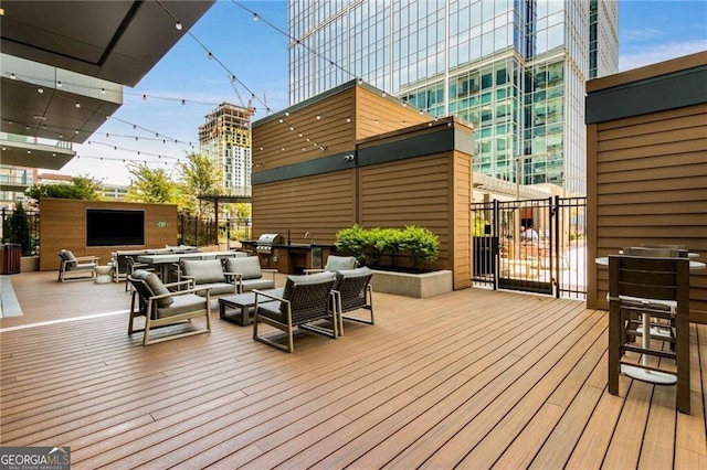 40 12th St NE Unit 803, Atlanta, GA 30309 - wooden terrace featuring an outdoor living space and area for grilling