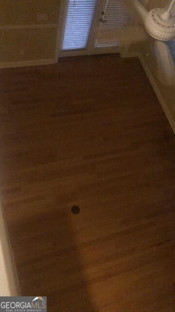 details with baseboards and wood finished floors