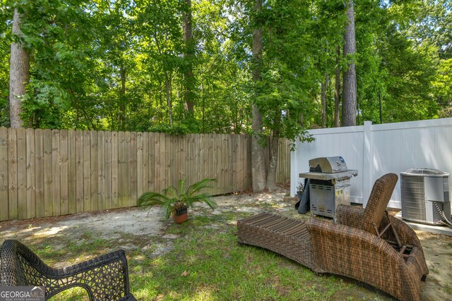 47 Reese Way, Savannah, GA 31419 - view of yard featuring central AC and a fenced backyard