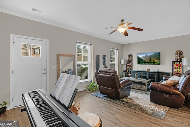 47 Reese Way, Savannah, GA 31419 - living room with crown molding, light wood-type flooring, visible vents, baseboards, and ceiling fan