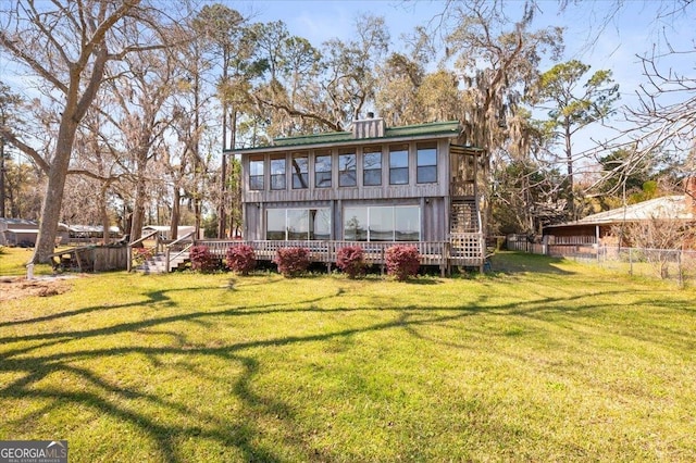 863 Hickory Bluff Rd, Waverly, GA 31565 - rear view of property featuring a yard, a wooden deck, and fence