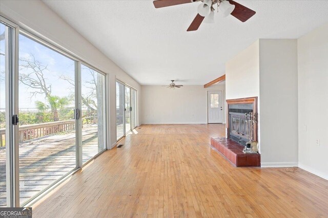 863 Hickory Bluff Rd, Waverly, GA 31565 - unfurnished living room with ceiling fan, baseboards, and light wood-type flooring
