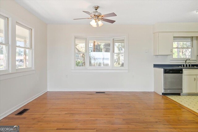 863 Hickory Bluff Rd, Waverly, GA 31565 - interior space with ceiling fan, light wood finished floors, visible vents, and a sink