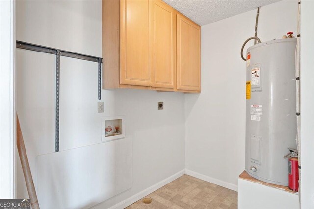 863 Hickory Bluff Rd, Waverly, GA 31565 - laundry room featuring cabinet space, electric water heater, electric dryer hookup, baseboards, and hookup for a washing machine