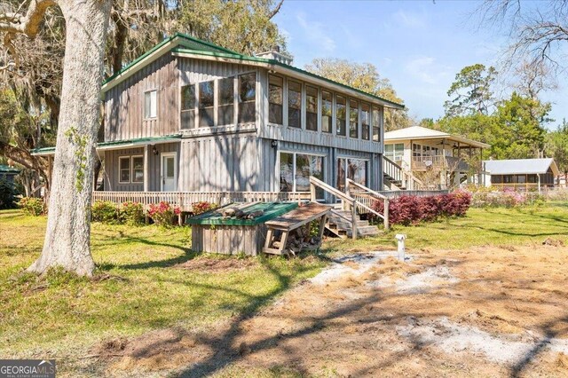 863 Hickory Bluff Rd, Waverly, GA 31565 - back of house featuring a lawn