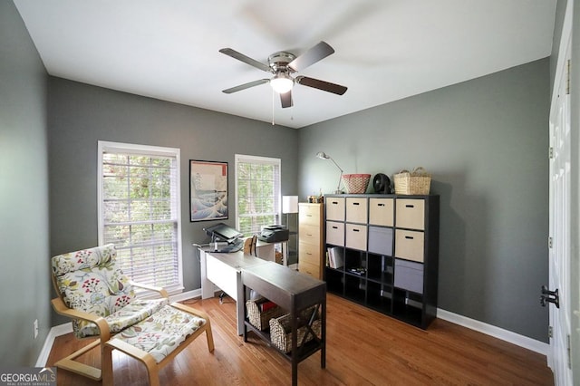 home office featuring wood finished floors, baseboards, and ceiling fan