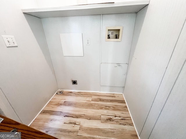clothes washing area with wood finished floors, laundry area, electric dryer hookup, baseboards, and hookup for a washing machine