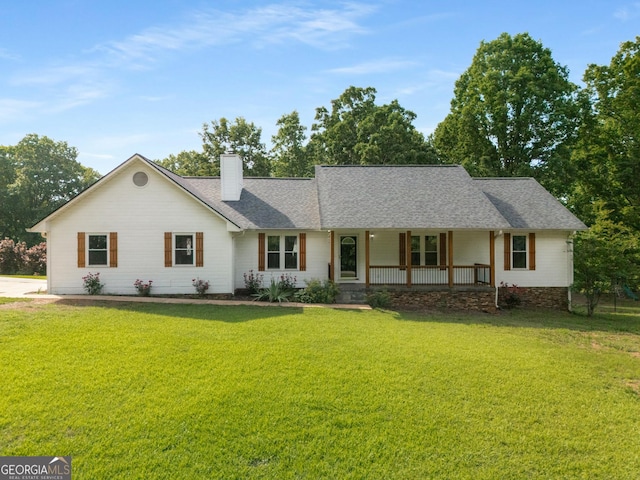 single story home with a chimney, a front yard, a porch, and roof with shingles