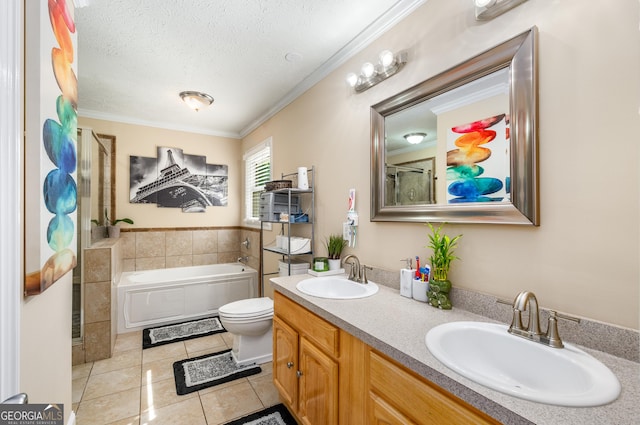full bathroom with tile patterned floors, a bath, ornamental molding, and a sink
