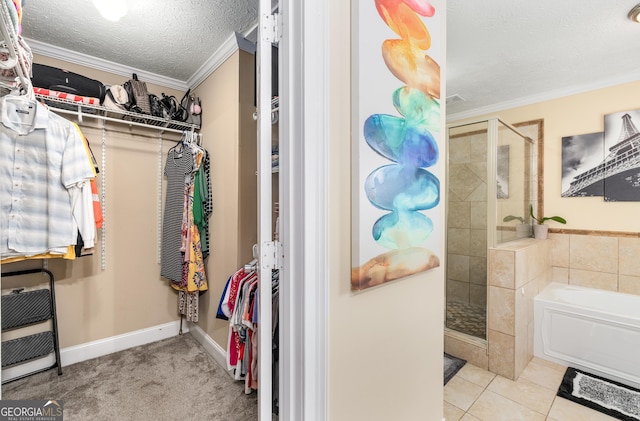 spacious closet featuring tile patterned floors