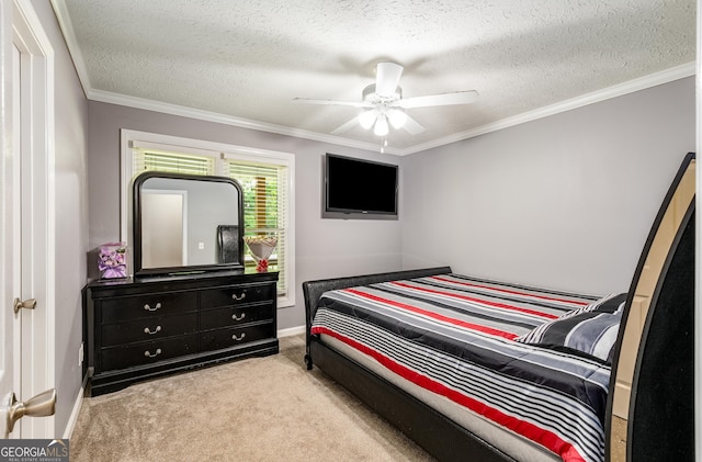 carpeted bedroom with baseboards, ornamental molding, a ceiling fan, and a textured ceiling