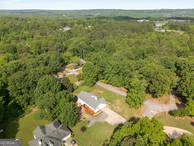 bird's eye view featuring a forest view
