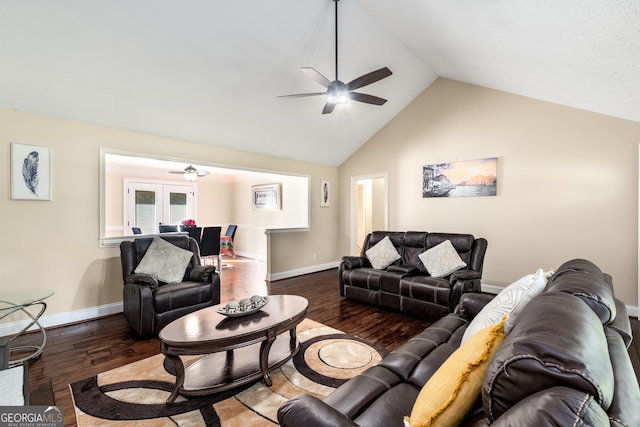living room with wood finished floors, baseboards, ceiling fan, and high vaulted ceiling