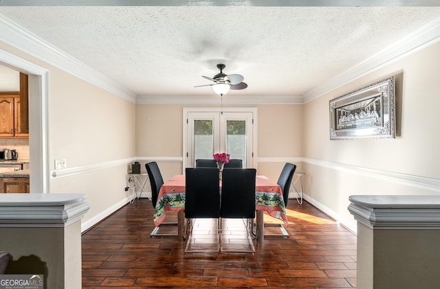 dining area with dark wood-style flooring, crown molding, a ceiling fan, and french doors