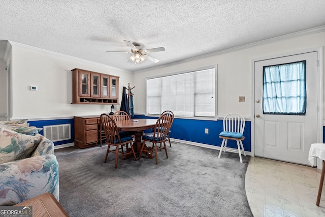 873 Austin Rd, Newnan, GA 30263 - carpeted dining room with ornamental molding, ceiling fan, a textured ceiling, and baseboards