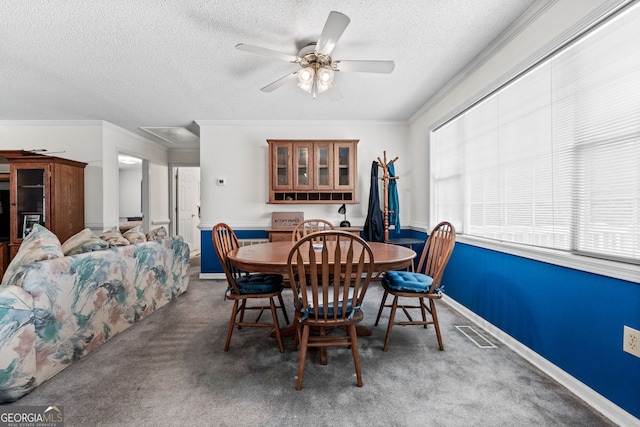 873 Austin Rd, Newnan, GA 30263 - carpeted dining space featuring a textured ceiling, ceiling fan, attic access, crown molding, and baseboards