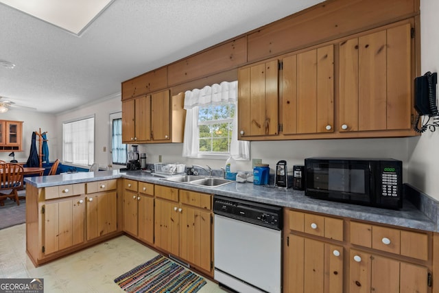 873 Austin Rd, Newnan, GA 30263 - kitchen featuring dishwasher, black microwave, a sink, a peninsula, and a textured ceiling