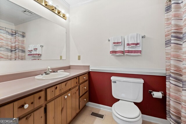 873 Austin Rd, Newnan, GA 30263 - full bathroom featuring ornamental molding, toilet, vanity, baseboards, and tile patterned floors