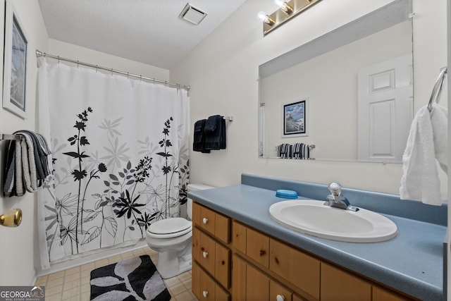 873 Austin Rd, Newnan, GA 30263 - full bathroom with toilet, vanity, a textured ceiling, and a shower with shower curtain