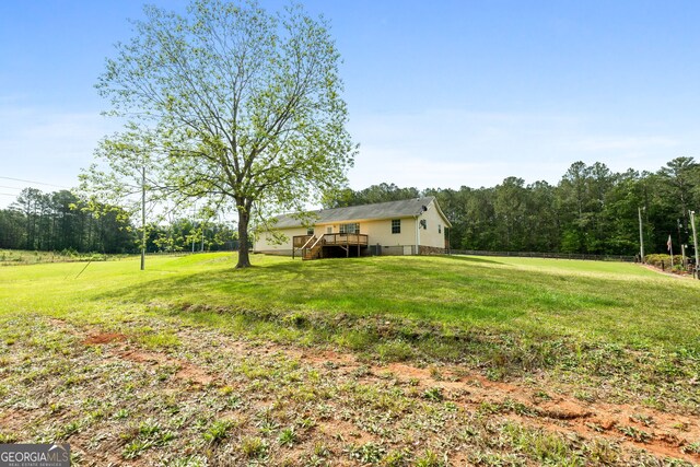 873 Austin Rd, Newnan, GA 30263 - view of grassy yard with a deck and stairs