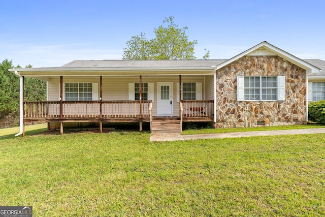 873 Austin Rd, Newnan, GA 30263 - ranch-style home with stone siding, a porch, and a front yard