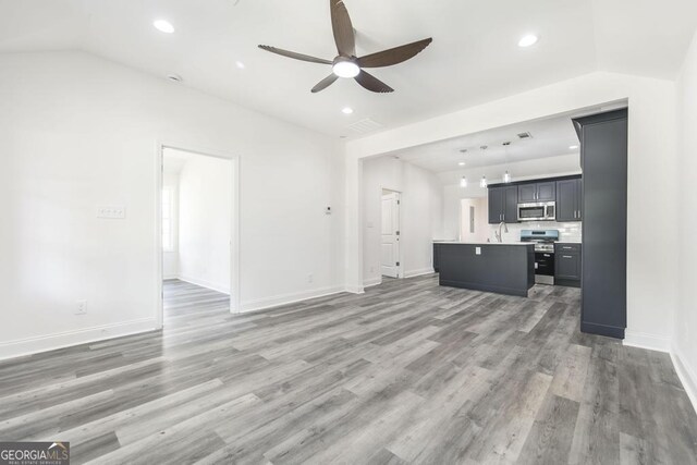 2349 Berthadale Ave, Macon, GA 31204 - unfurnished living room with recessed lighting, baseboards, ceiling fan, a sink, and light wood-style floors
