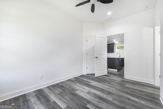 2349 Berthadale Ave, Macon, GA 31204 - unfurnished bedroom featuring dark wood finished floors, visible vents, baseboards, and ensuite bathroom