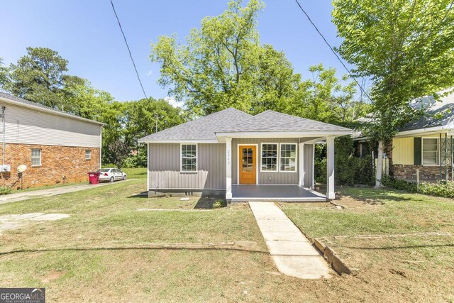 2349 Berthadale Ave, Macon, GA 31204 - view of front of house with a porch, roof with shingles, and a front yard