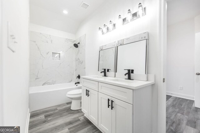 2349 Berthadale Ave, Macon, GA 31204 - bathroom with toilet, double vanity, a sink, and tub / shower combination