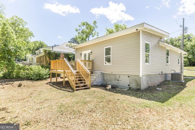2349 Berthadale Ave, Macon, GA 31204 - rear view of property featuring stairway, a deck, central AC, and a lawn