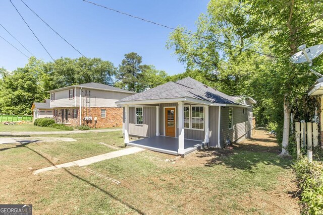 2349 Berthadale Ave, Macon, GA 31204 - view of front facade with a front yard and a shingled roof
