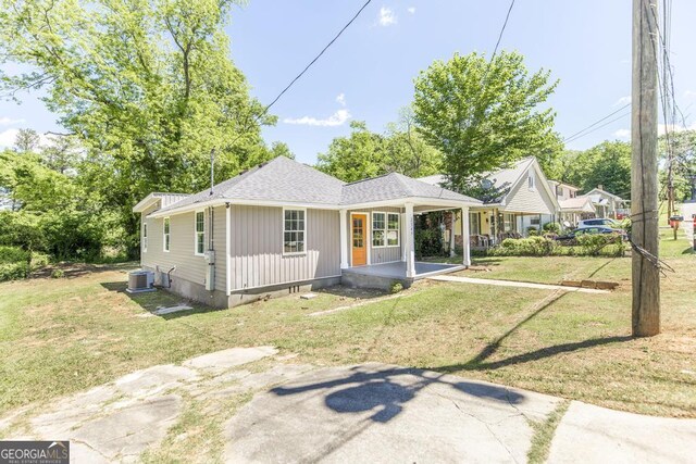 2349 Berthadale Ave, Macon, GA 31204 - back of property with covered porch, a shingled roof, a lawn, and central air condition unit