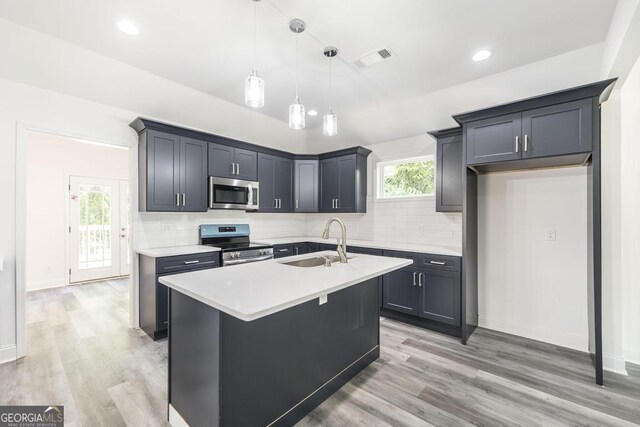 2349 Berthadale Ave, Macon, GA 31204 - kitchen with a sink, stainless steel appliances, visible vents, light countertops, and decorative backsplash
