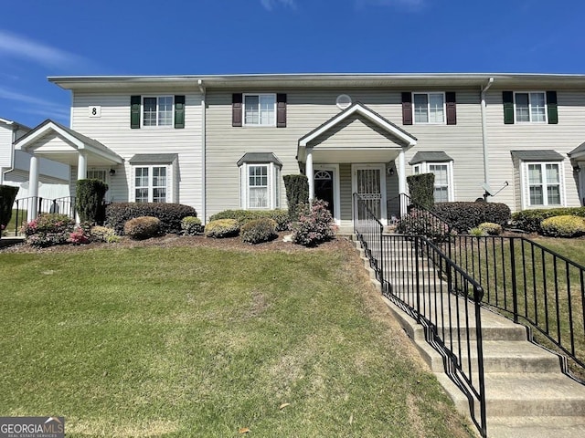 view of property with a front lawn