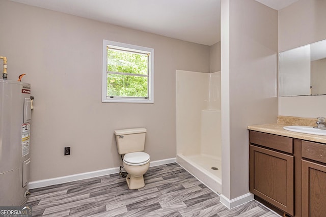 full bath featuring toilet, baseboards, vanity, a shower, and water heater