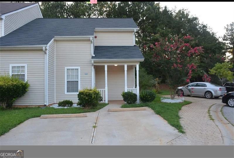 6460 Wellington Chase Ct, Lithonia, GA 30058 - view of front of home featuring a porch