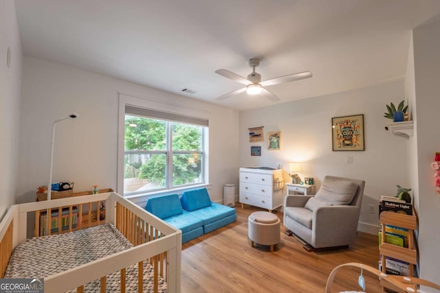 82 Dearborn St SE, Atlanta, GA 30317 - bedroom featuring wood finished floors, a nursery area, and baseboards